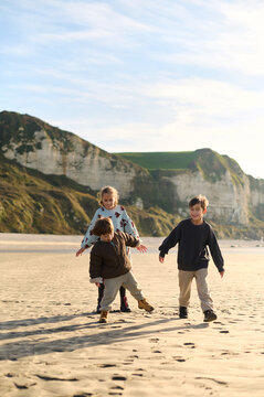 children playing on the beach