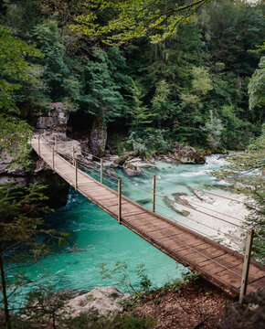 Suspension footbridge above Soca River in Slovenia 