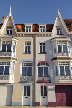 Traditional coastal houses with colorful facades and bay windows