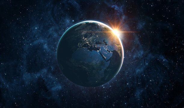 Planet Earth illuminated by sunrise against a deep space background with stars and nebulae, symbolizing global connection, science, astronomy.  Elements of this image furnished by NASA.