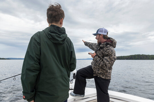 Fishing Guide with teen boy client  on lake