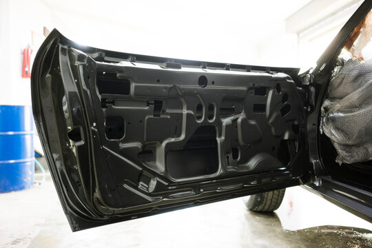 Stripped Inner Car Door Panel Exposed During Auto Restoration