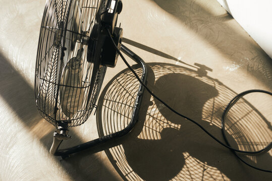 Black fan casting shadows