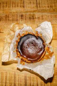 Basque burnt cheesecake on parchment paper after dinner party