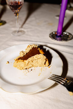 Slice of Basque burnt cheesecake on plate after dinner