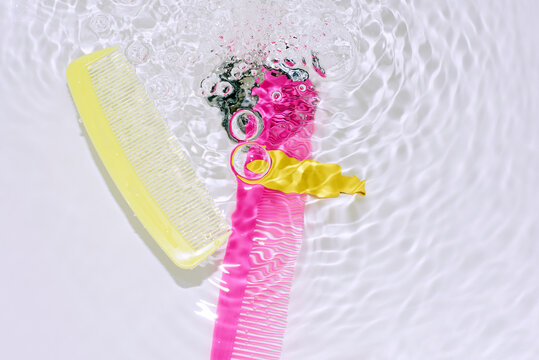 combs floating in water with bubbles and light.