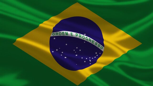 Brazilian national flag waving smoothly in the wind featuring the green field yellow rhombus and blue celestial globe with white stars and motto
