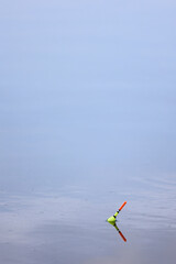 Fishing float on calm water surface © k49red