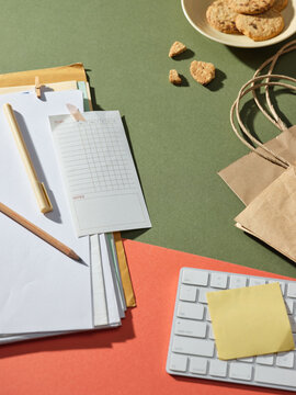 Organized desk with to-do list, keyboard, and snacks