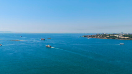 Istanbul, Turkey. European shore of Bosphorus Strait with passenger ferries and water taxis sailing on clear sunny day. Aerial View © Video Render