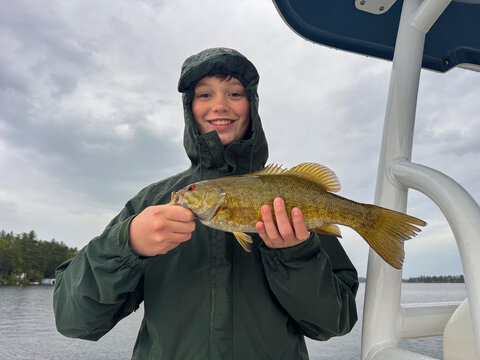Fisherman teen boy smile  fish proud 
