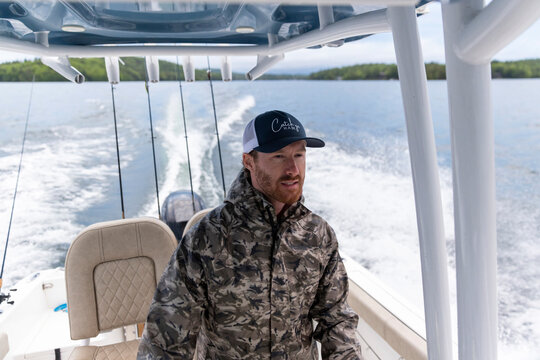 Confident Boat Fisherman Portrait smile at helm 