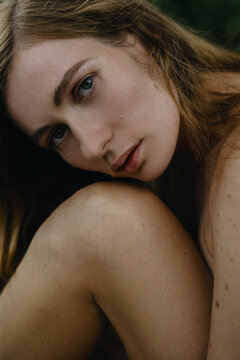 Woman's Close up natural Portrait with moles on the face 
