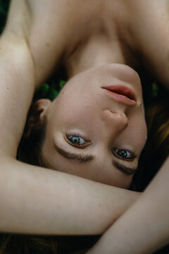 Light Brunette Woman's Close up Portrait with moles on the face 