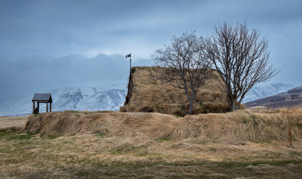 Grafarkirkja turf church with snowy mountains. Iceland, icelandic landscape