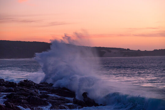 A Powerful wave breaking at sunset