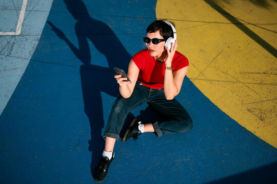 Woman enjoying music on smartphone and headphones