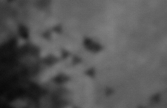 Abstract dark inkblot on textured background
