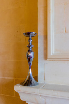 Elegant Silver Candlestick on Stone Mantel &mdash; Modern Interior Fireplace Decor Accent