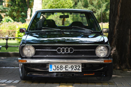 Front view of a vintage black Audi 80 B1 (Typ 80) classic German oldtimer with custom front spoiler lip. Subotica, Serbia, on June 7, 2026