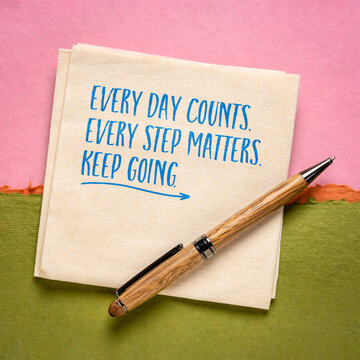 Every Day Counts. Every Step Matters. Keep Going. &ndash; inspirational handwritten note on a napkin with pen, encouraging consistency, perseverance, and steady personal growth.