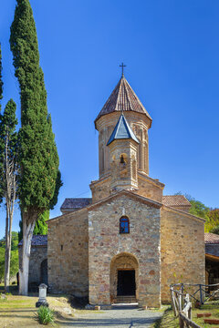 Ancient Ikalto Monastery cathedral stands in Kakheti region, Georgia. Front facade view under a clear sky in daylight