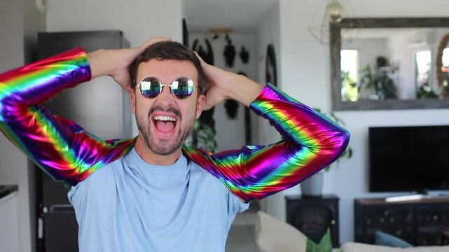 Dancer wearing a colorful rainbow shirt and eyeglasses 