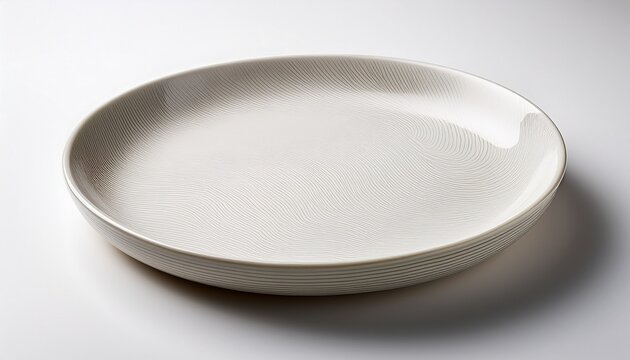 of minimalist white round plate showcasing modern design and simplicity on white background