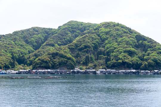 Traditional Ine Fishing Village, Kyoto prefecture, Japan, Funaya, traditional wooden boat houses, from the Ine Bay during boat tour cruise