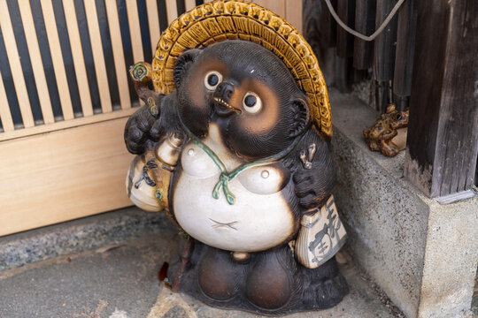 Tanuki statue in front of a business in Japan, said to bring good fortune