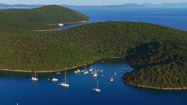 Aerial view of Yachts anchored at Saint Nicholas Island in Syvota scenic islet off the coast of mainland Greece