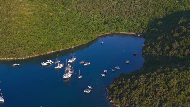 Aerial view of Yachts anchored at Saint Nicholas Island in Syvota scenic islet off the coast of mainland Greece