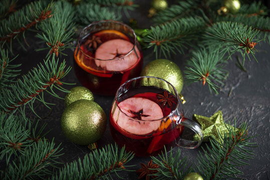 Mulled wine serving with Christmas spices and evergreen branches