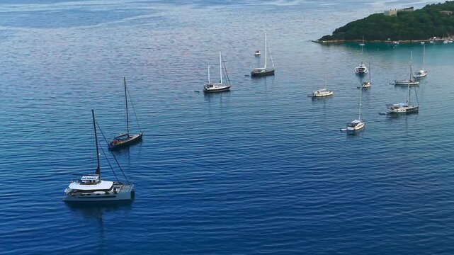 Aerial view of Yachts anchored at Saint Nicholas Island in Syvota scenic islet off the coast of mainland Greece