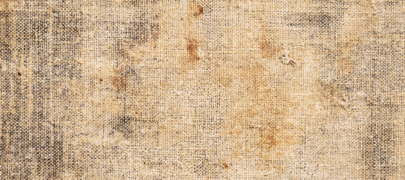 Macro view of woven textured fabric surface showing coarse beige fibers with material background interwoven materialistic tapestry structure interlaced abstract backdrop