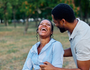 Fototapeta premium Happy young black couple, portrait of a beautiful woman with her husband dancing or swinging and holding hands in park outdoors