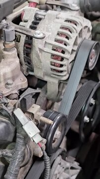 Steps to replace an alternator belt in a car engine