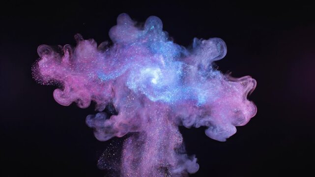 Abstract mesmerizing swirl of colorful pink and blue ink clouds dissolving in water against a dark background with glowing luminous particles and magical cosmic nebula effect