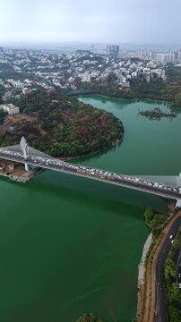 Vertical aerial shot of traffic Jam at Durgam Cheruvu in Hyderabad, India