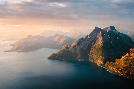Aerial view sea and rocky mountains island in northern Norway sunset landscape tranquil scenery in Scandinavia summer season scenic nature travel beautiful destinations