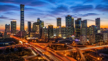 Obraz premium Modern Beijing central business district skyline at blue hour with illuminated skyscrapers and busy highways