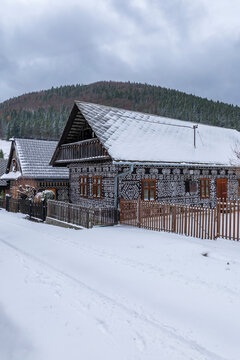 Cicmany village houses decorated with folk geometric patterns in snow
