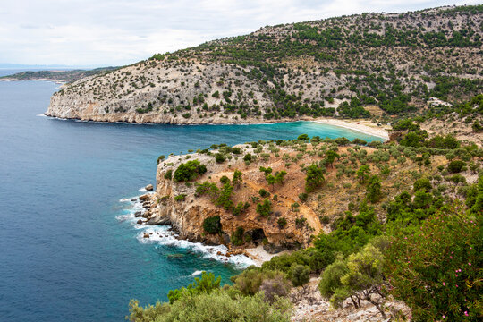Scenic high-angle coastal view with the turquoise waters of Livadi Beach, southeastern coast of Thassos, Northern Greek Aegean Sea