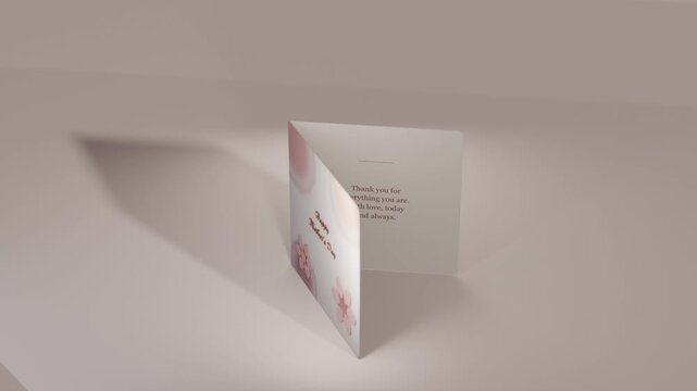 Rotating camera causing folded card opening at studio set to reveal Mother's Day message, spotlight