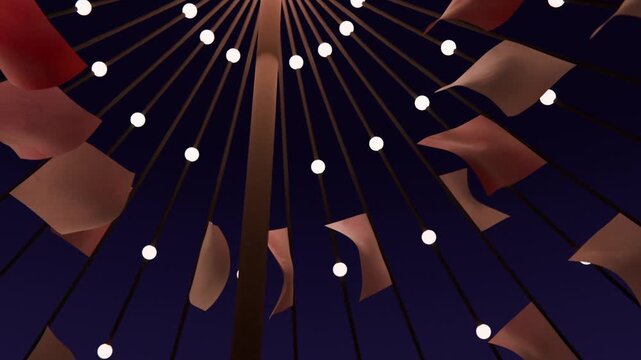 Shifting fabric pennants on spokes fluttering beneath tent at night with breeze moving, pole lights