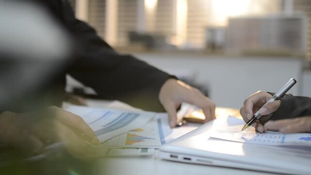 Accountants processing financial documents and taxes, managing corporate finance in a modern office. Audit and taxes in business