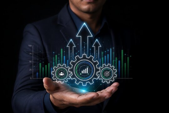 Businessman holding glowing digital gears and growth charts for business development