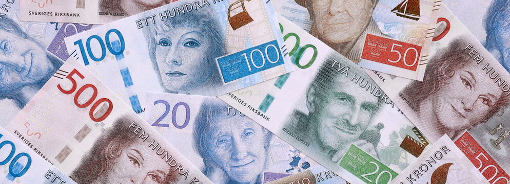 Swedish krona money bills pile on table. Sweden banknotes of SEK currency close up.