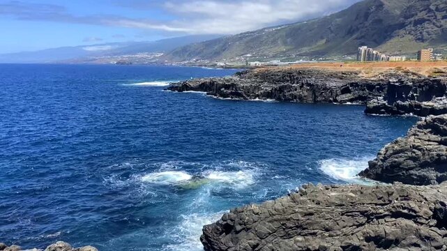 View of Puertito de Los Silos volcanic coastline with natural ocean pool the Charco de la Ara&ntilde;a, Tenerife, Canary Islands, Spain,4K. 
