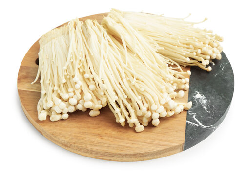 Clusters of raw enoki mushrooms isolated on white